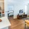 kitchen with island and appliances and living area